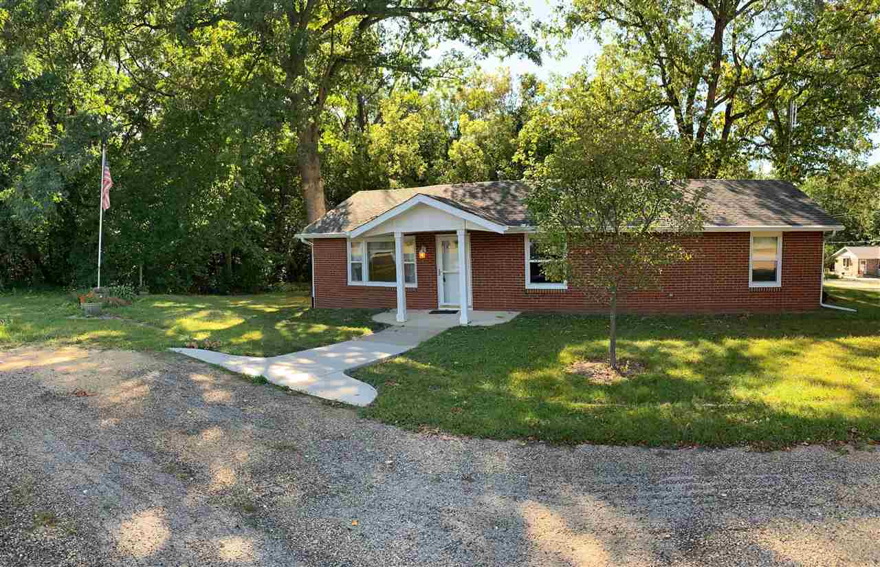 1176 Daysville Road Oregon, IL 61061 - Photo 1 of 34 a front view of a house with a garden and yard