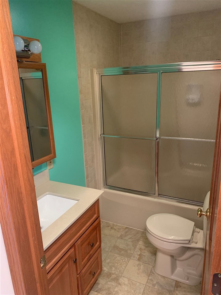 1176 Daysville Road Oregon, IL 61061 - Photo 21 of 34 a bathroom with a sink a toilet and shower