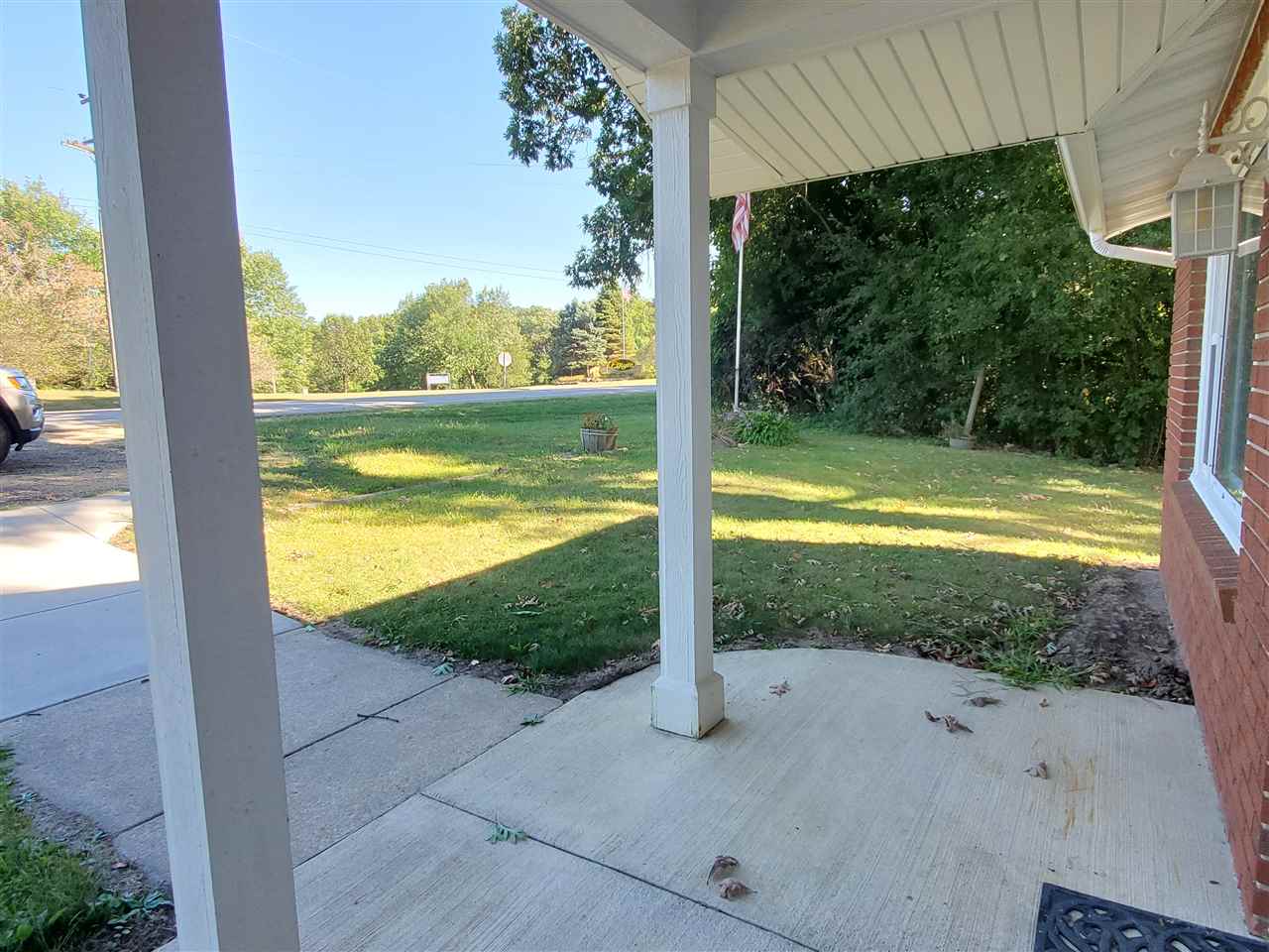 1176 Daysville Road Oregon, IL 61061 - Photo 25 of 34 a view of a room with a floor to ceiling window and a yard