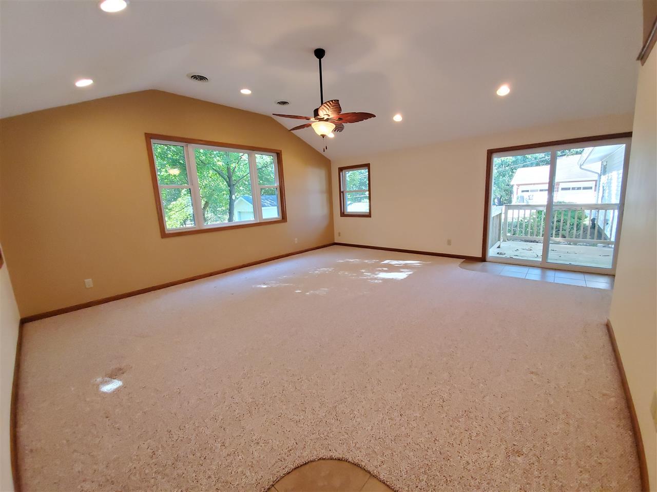 1176 Daysville Road Oregon, IL 61061 - Photo 5 of 34 an empty room with windows and ceiling fan