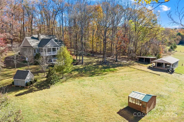 a swimming pool with some trees in the background