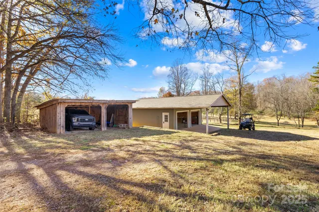 a view of a house with a yard covered in snow