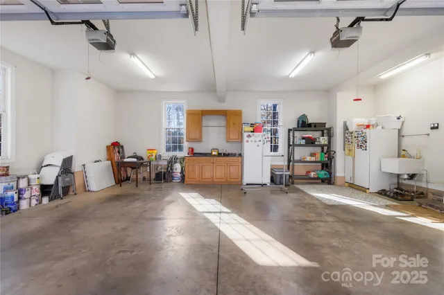 a living room with furniture and a gym equipment