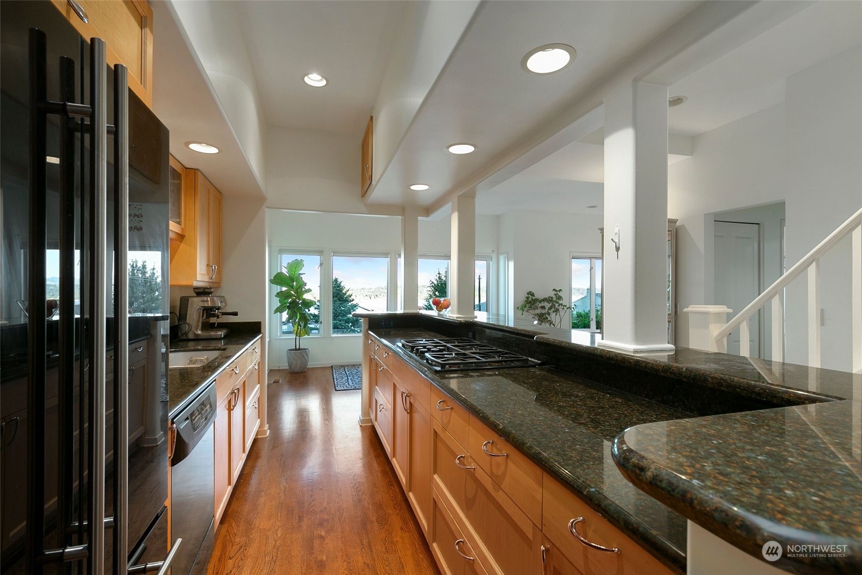 3205 South Judkins Street Seattle, WA 98144 - Photo 14 of 40 a kitchen with counter top space a sink and stainless steel appliances