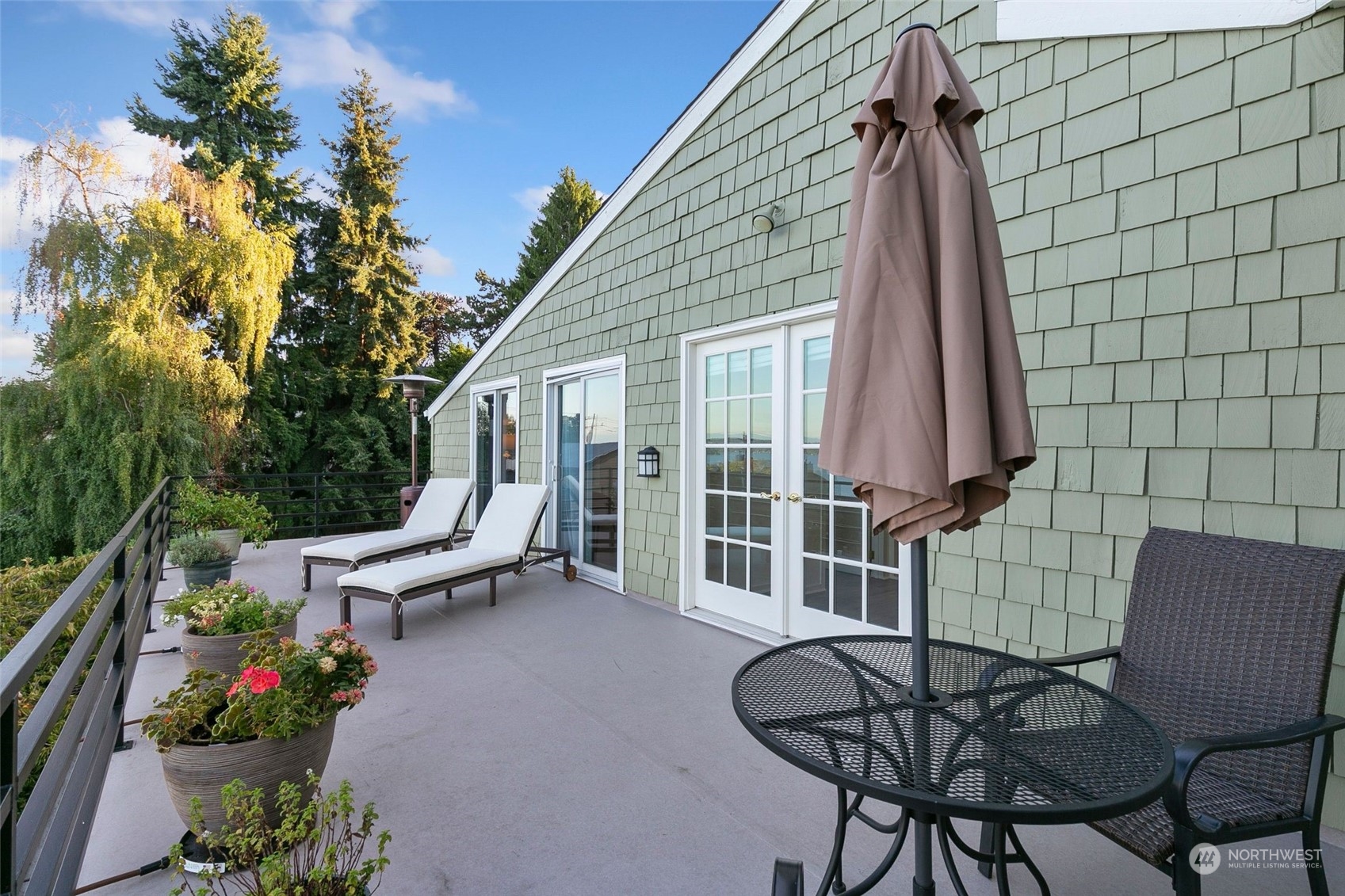 3205 South Judkins Street Seattle, WA 98144 - Photo 25 of 40 a view of a patio with a table and chairs and potted plants