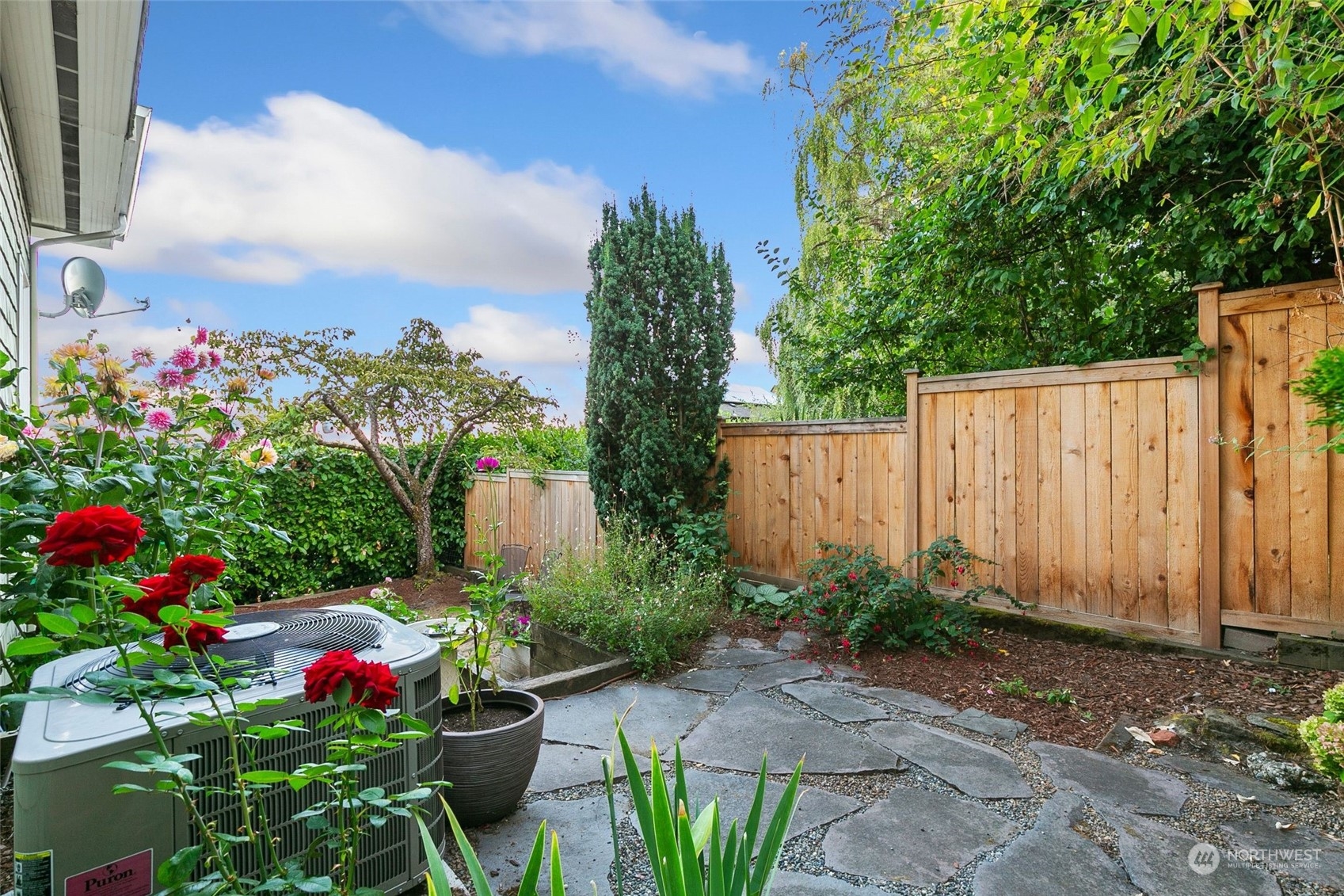 3205 South Judkins Street Seattle, WA 98144 - Photo 37 of 40 a view of flower garden with wooden fence
