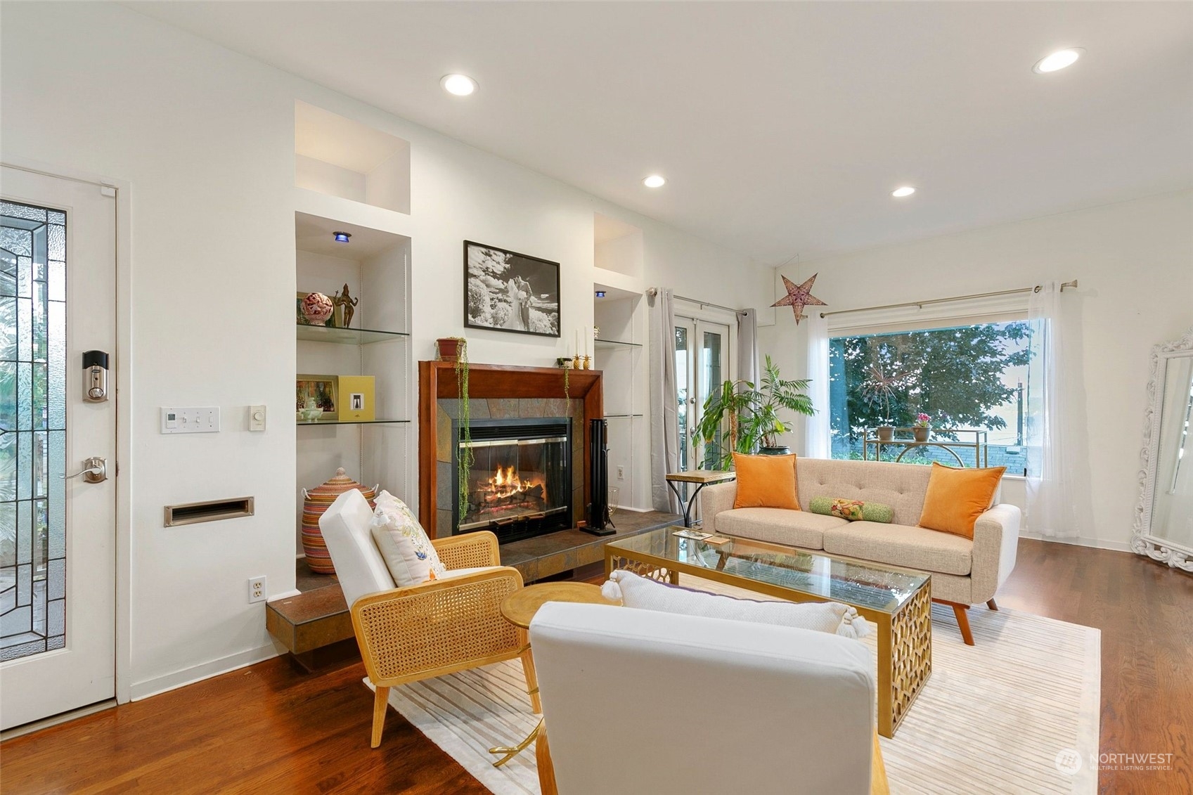 3205 South Judkins Street Seattle, WA 98144 - Photo 7 of 40 a living room with furniture a fireplace and a large window