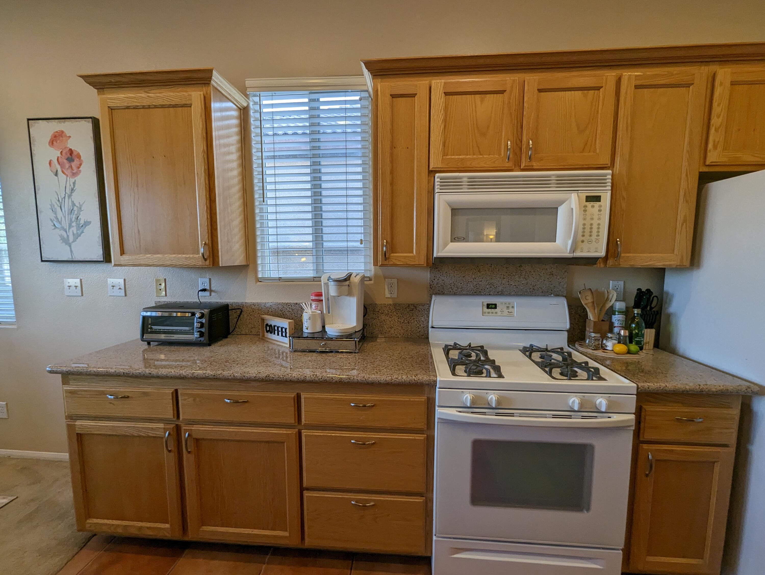 49544 Wayne Street Indio, CA 92201 - Photo 14 of 69 a kitchen with cabinets appliances and a window