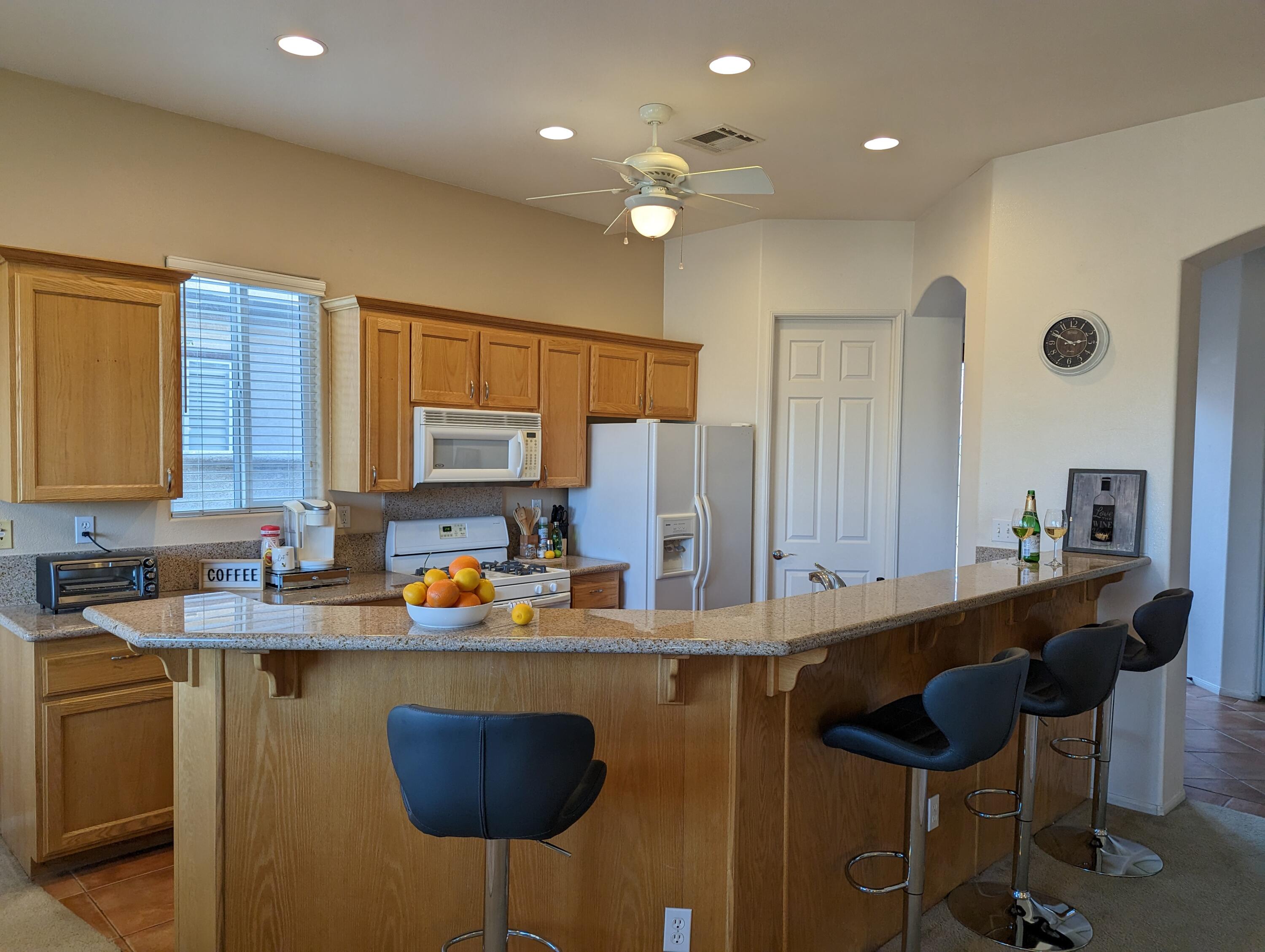 49544 Wayne Street Indio, CA 92201 - Photo 22 of 69 a kitchen with a sink cabinets and window