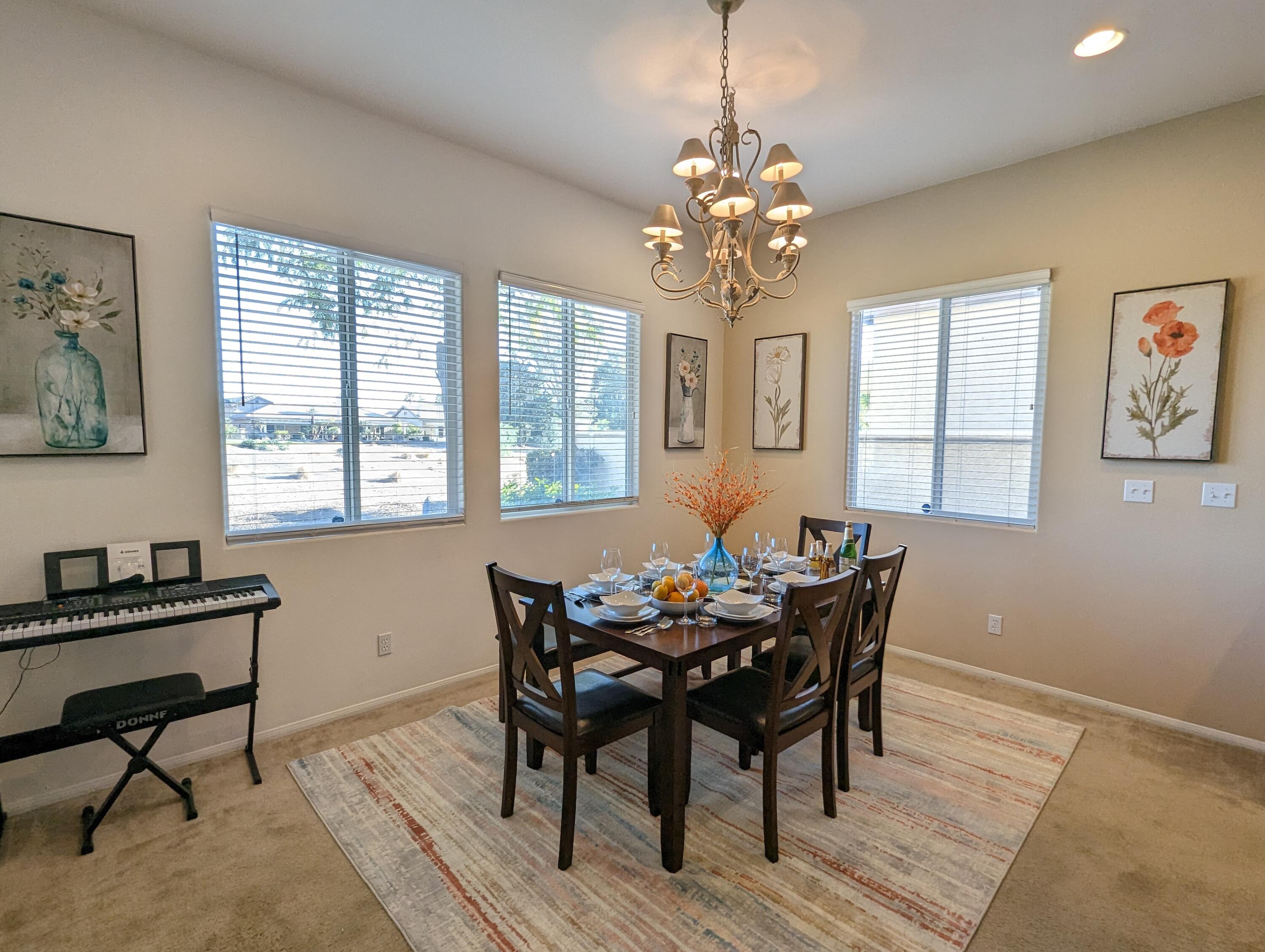 49544 Wayne Street Indio, CA 92201 - Photo 26 of 69 a view of a dining room with furniture window and wooden floor