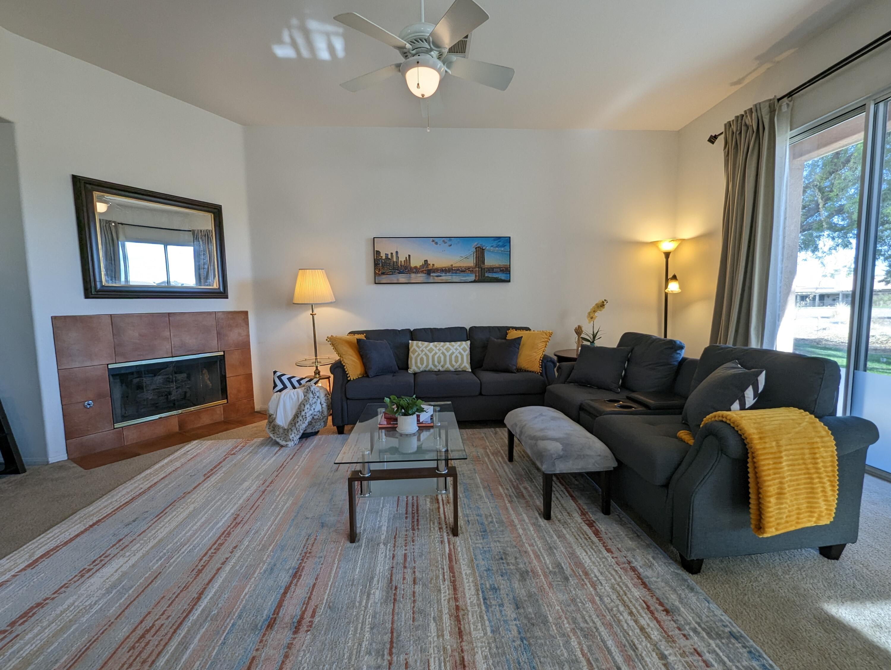 49544 Wayne Street Indio, CA 92201 - Photo 31 of 69 a living room with furniture and a fireplace