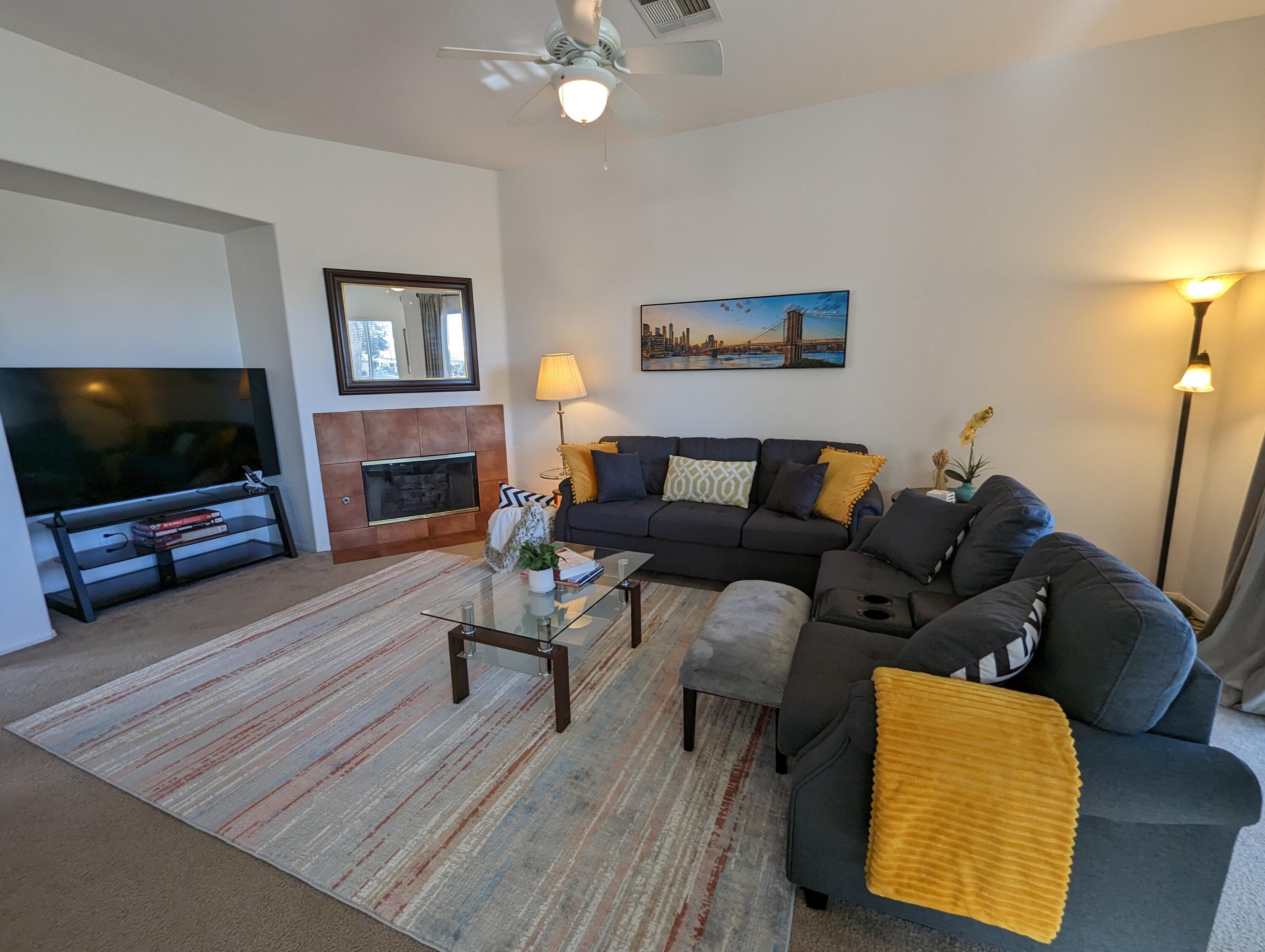 49544 Wayne Street Indio, CA 92201 - Photo 34 of 69 a living room with furniture and a flat screen tv