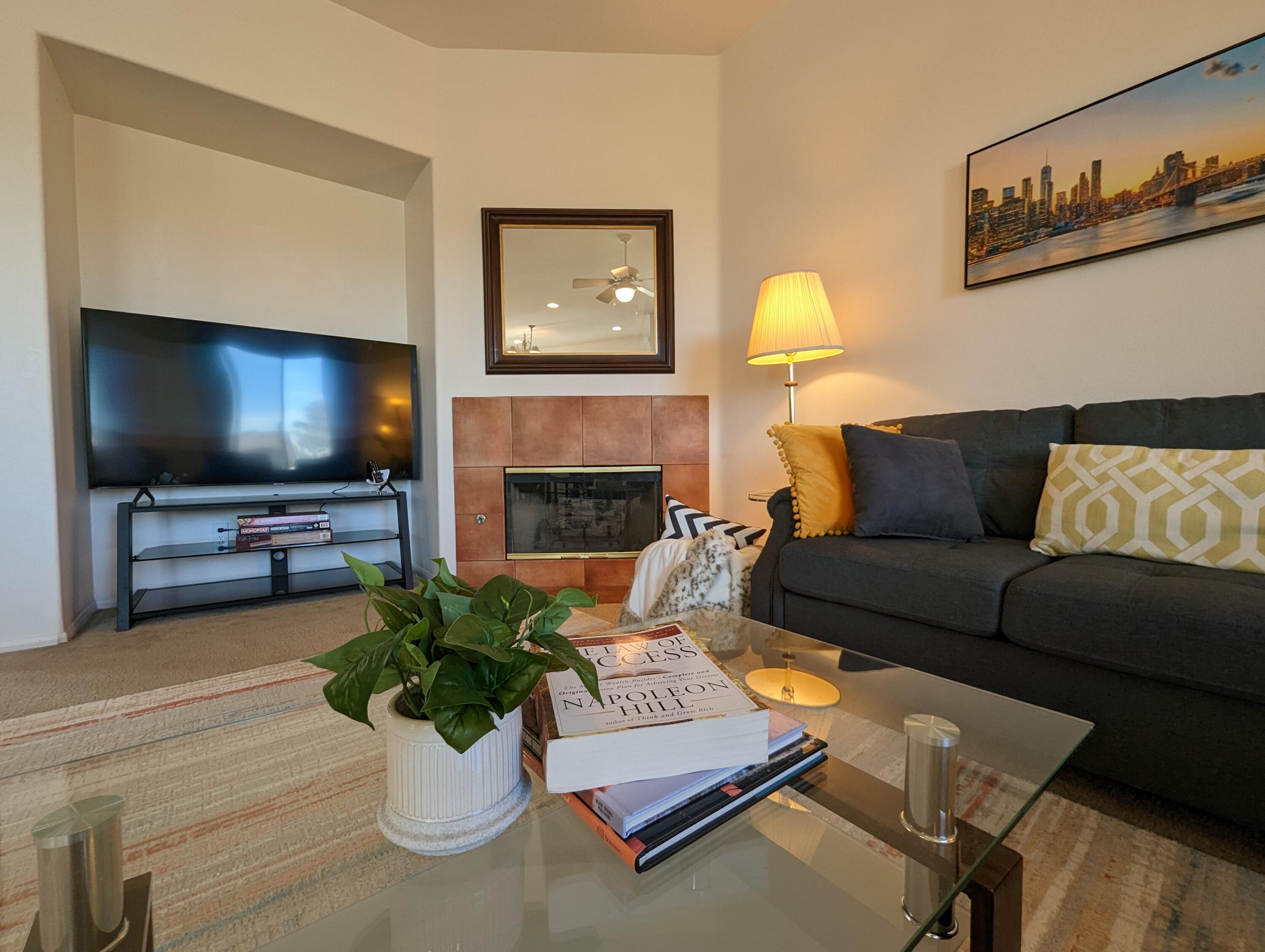 49544 Wayne Street Indio, CA 92201 - Photo 35 of 69 a living room with furniture and a flat screen tv