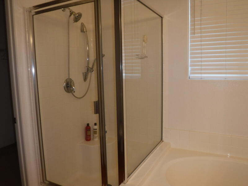 49544 Wayne Street Indio, CA 92201 - Photo 50 of 69 a bathroom with a glass shower door