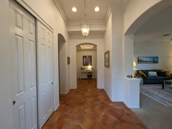 a kitchen with cabinets appliances and a window