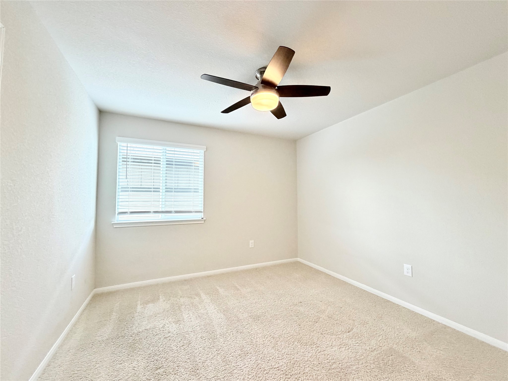 10502 Fulton Avenue Austin, TX 78754 - Photo 29 of 36 A well-lit bedroom offering a versatile space for rest or productivity.
