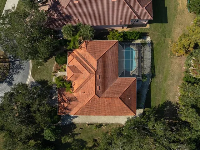 a aerial view of a house with big yard