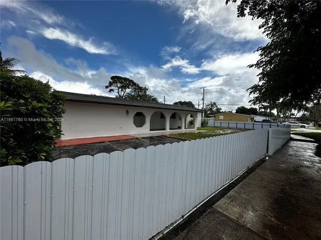 a view of a balcony with wooden fence