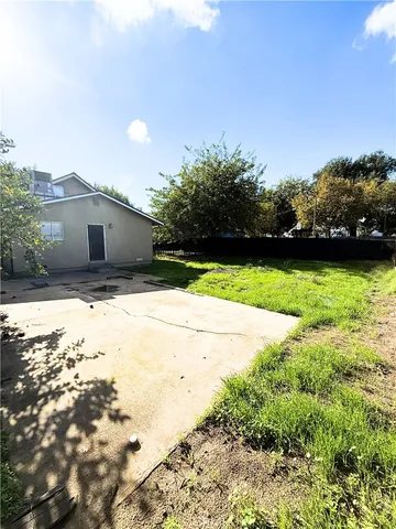 a view of a backyard of the house
