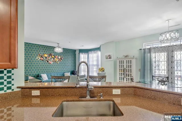 a kitchen with a sink and a large window