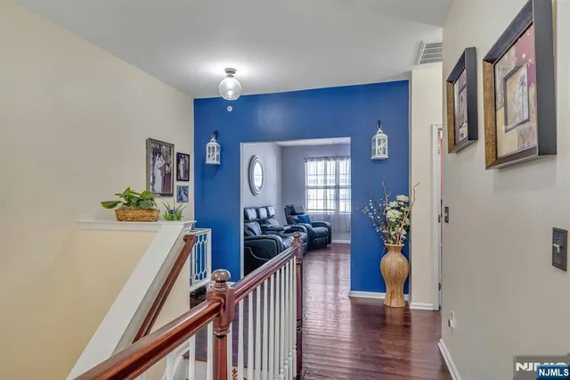 a view of an entryway with wooden floor