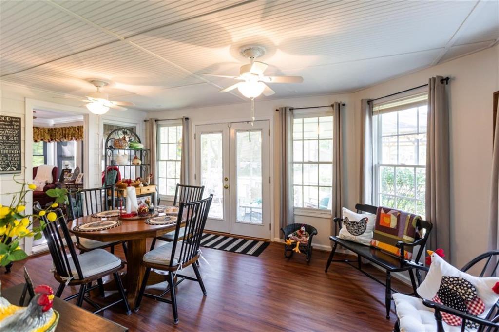 116 East Fulton Street Newborn, GA 30056 - Photo 28 of 74 a view of a dining room with furniture and wooden floor