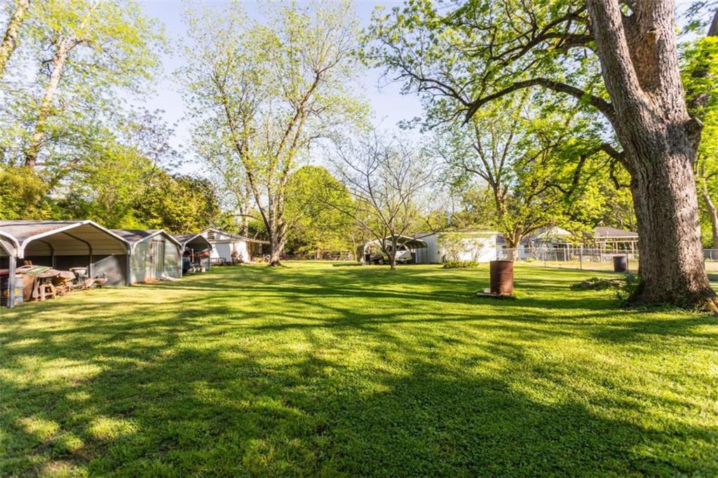 116 East Fulton Street Newborn, GA 30056 - Photo 58 of 74 a view of a yard with swimming pool
