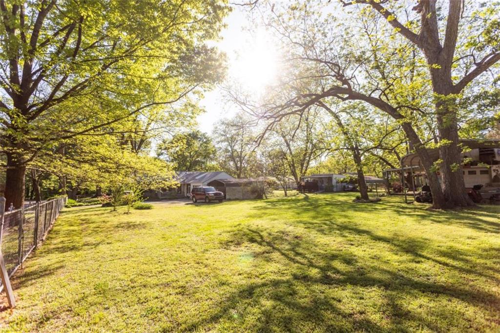 116 East Fulton Street Newborn, GA 30056 - Photo 65 of 74 a view of yard with swimming pool and trees