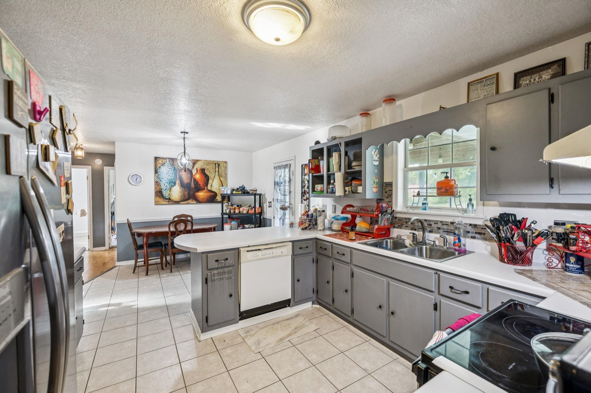 537 Isbell Lane Decherd, TN 37324 - Photo 13 of 40 a kitchen with cabinets a sink and appliances