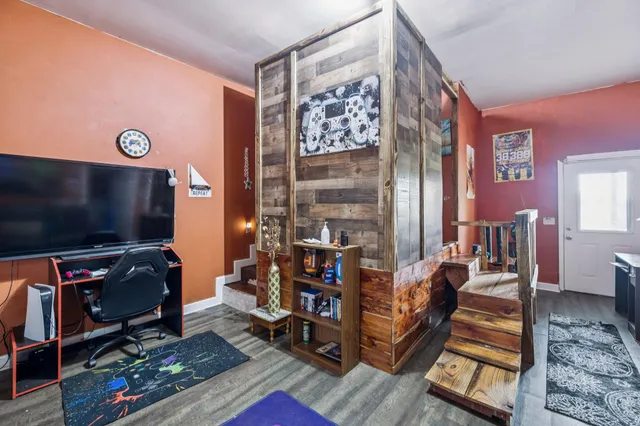 a living room with furniture and a flat screen tv