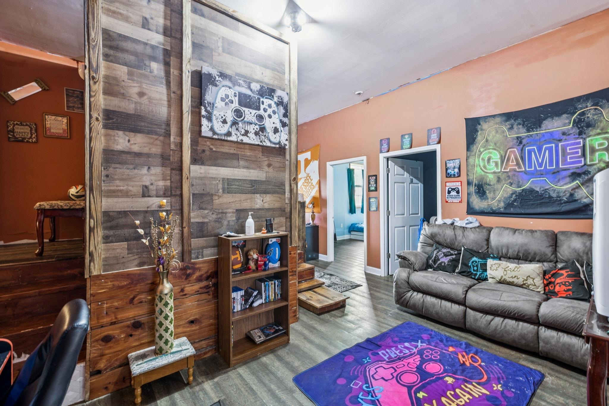 537 Isbell Lane Decherd, TN 37324 - Photo 20 of 40 a living room with furniture and a floor to ceiling window