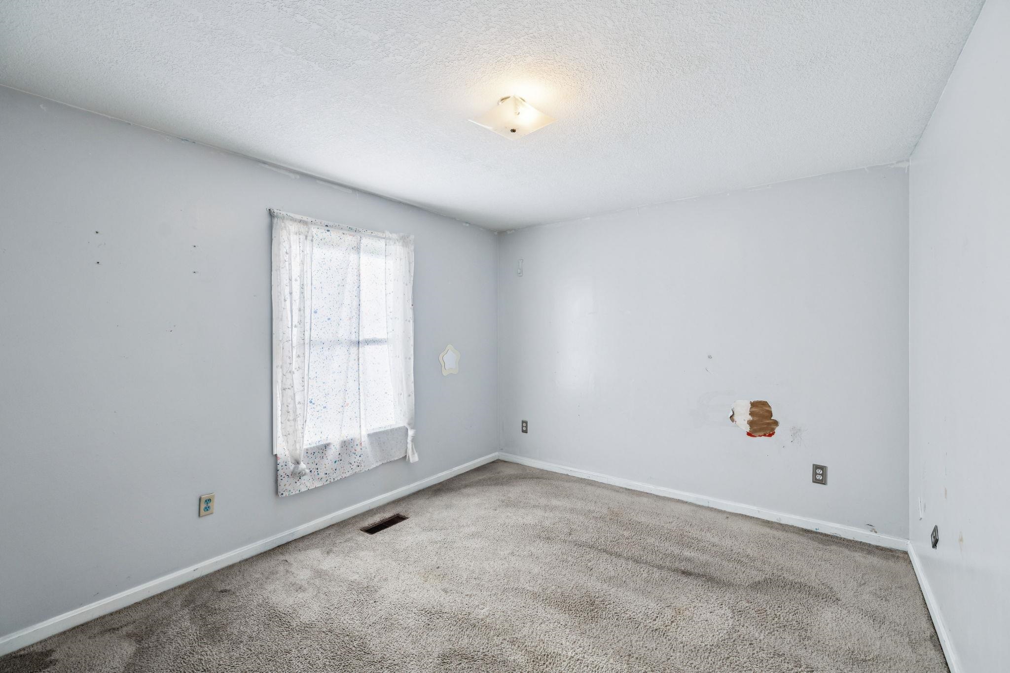 537 Isbell Lane Decherd, TN 37324 - Photo 23 of 40 an empty room with window