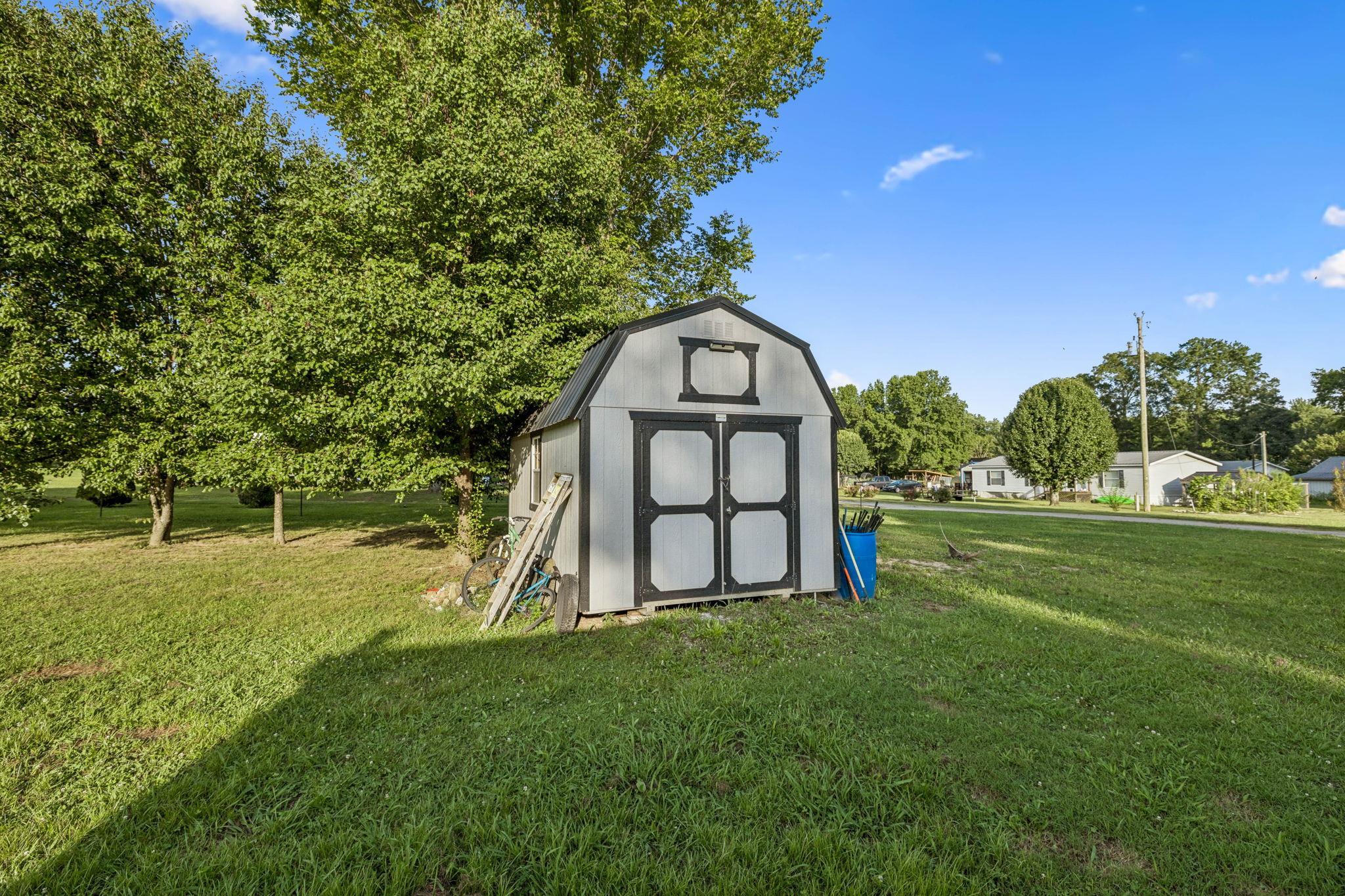 537 Isbell Lane Decherd, TN 37324 - Photo 37 of 40 a view of a garden with a house