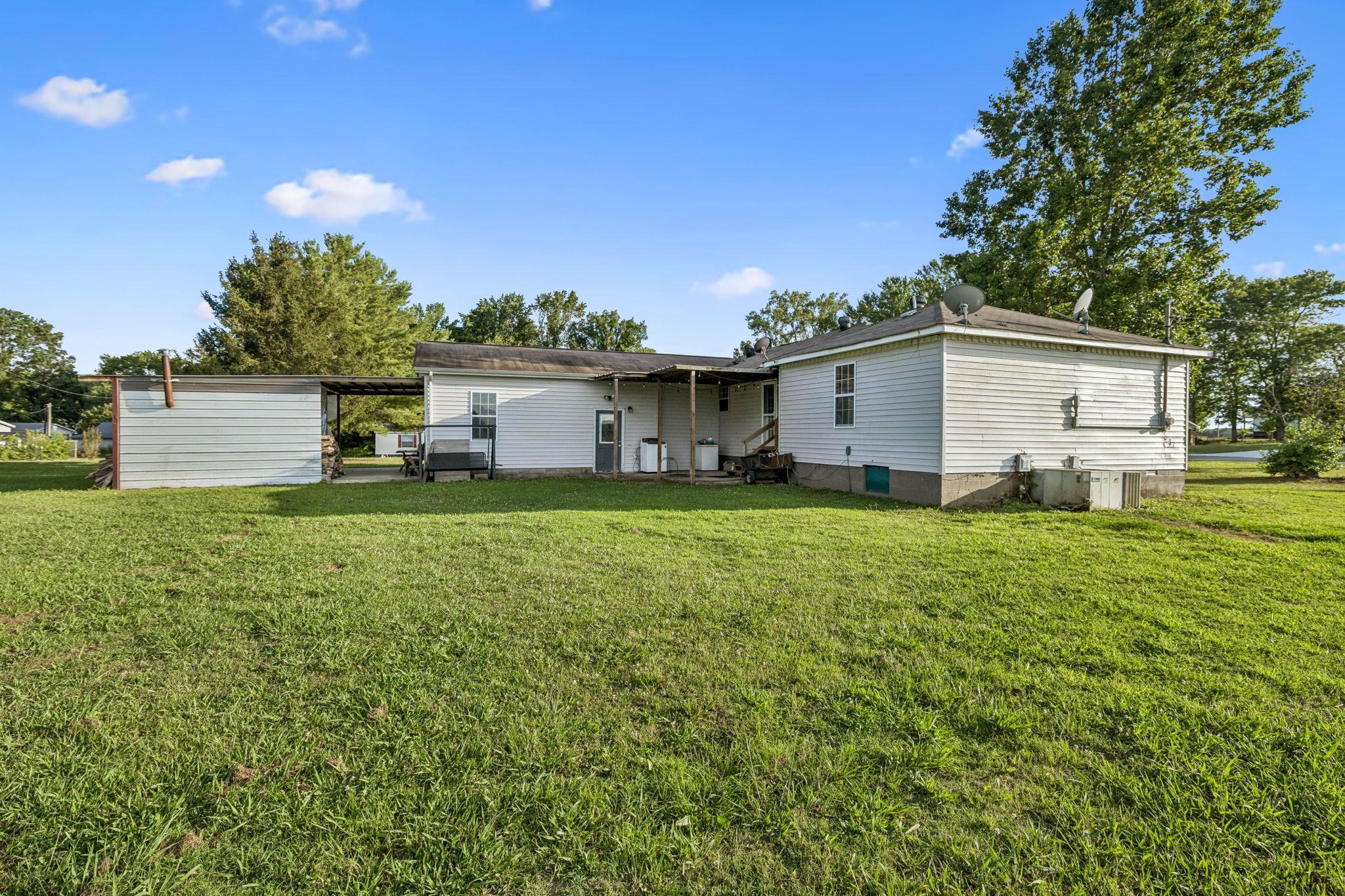 537 Isbell Lane Decherd, TN 37324 - Photo 39 of 40 a house view with a garden space