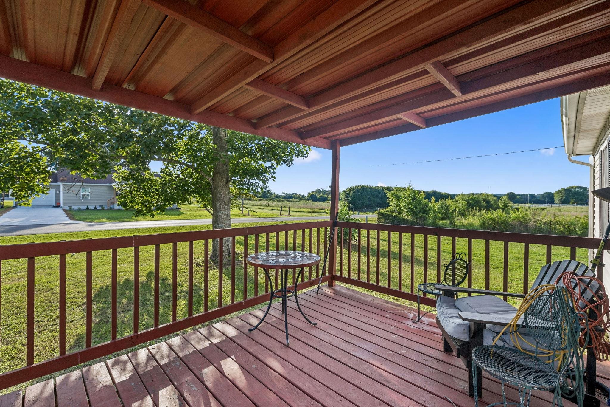 537 Isbell Lane Decherd, TN 37324 - Photo 4 of 40 a view of a balcony with wooden floor