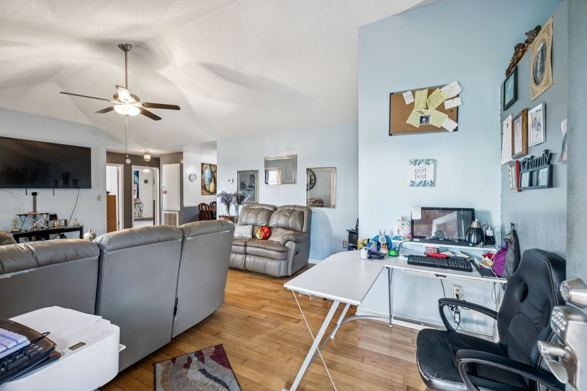 537 Isbell Lane Decherd, TN 37324 - Photo 5 of 40 a living room with furniture a flat screen tv and kitchen view