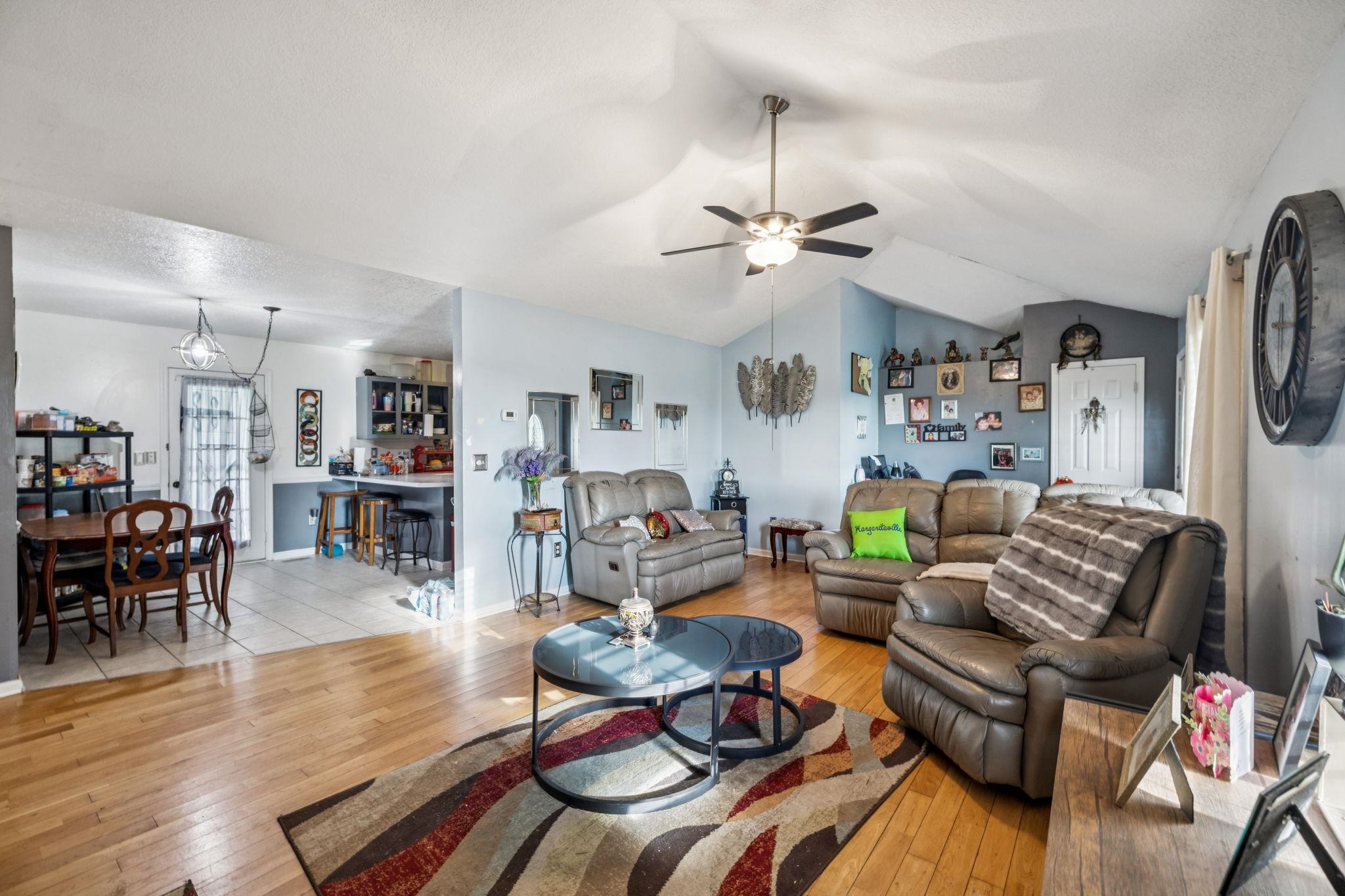537 Isbell Lane Decherd, TN 37324 - Photo 9 of 40 a living room with furniture kitchen view and a wooden floor