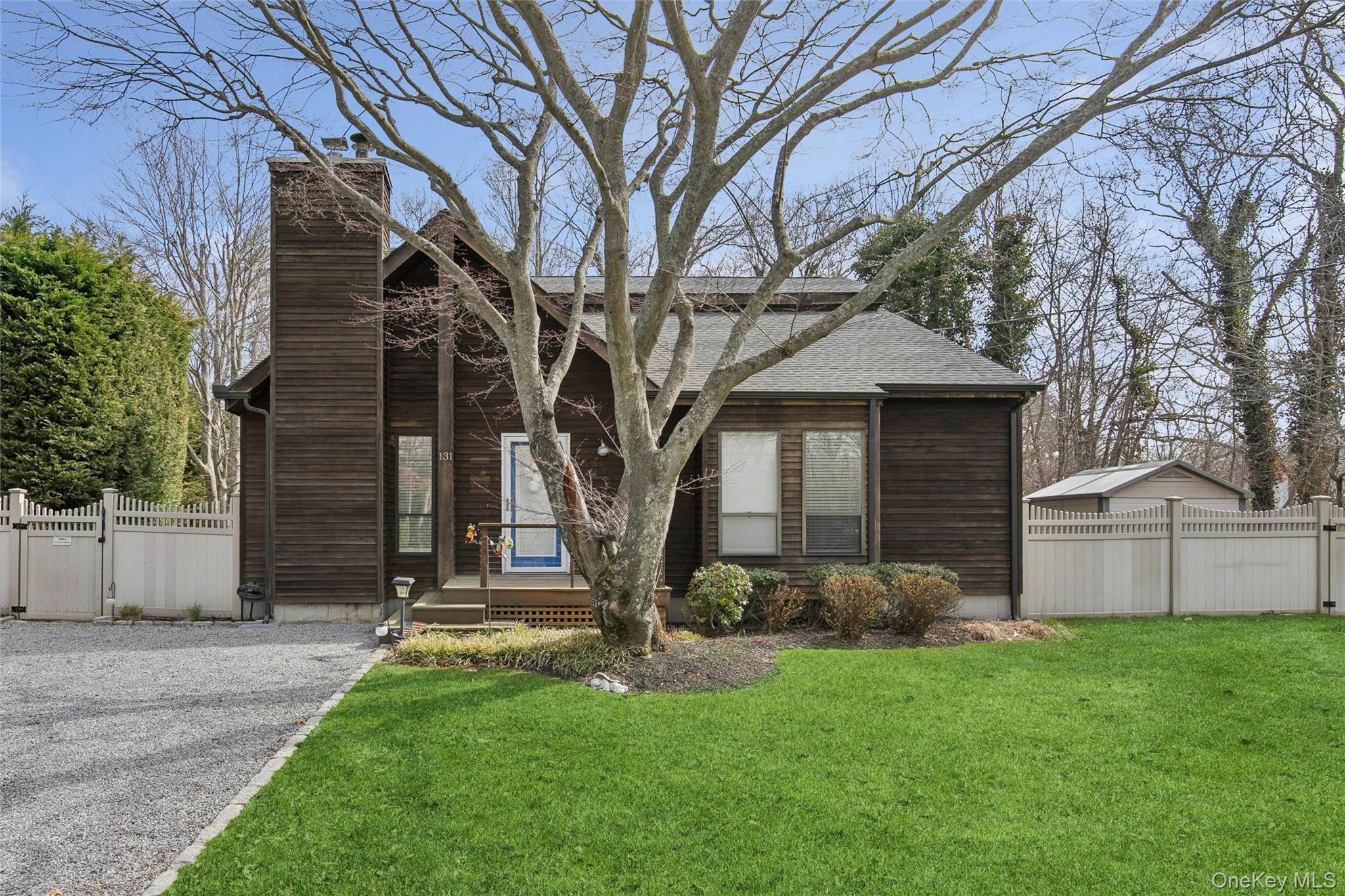131 Lewis Road East Quogue, NY 11942 - Photo 2 of 25 a view of a house with a yard