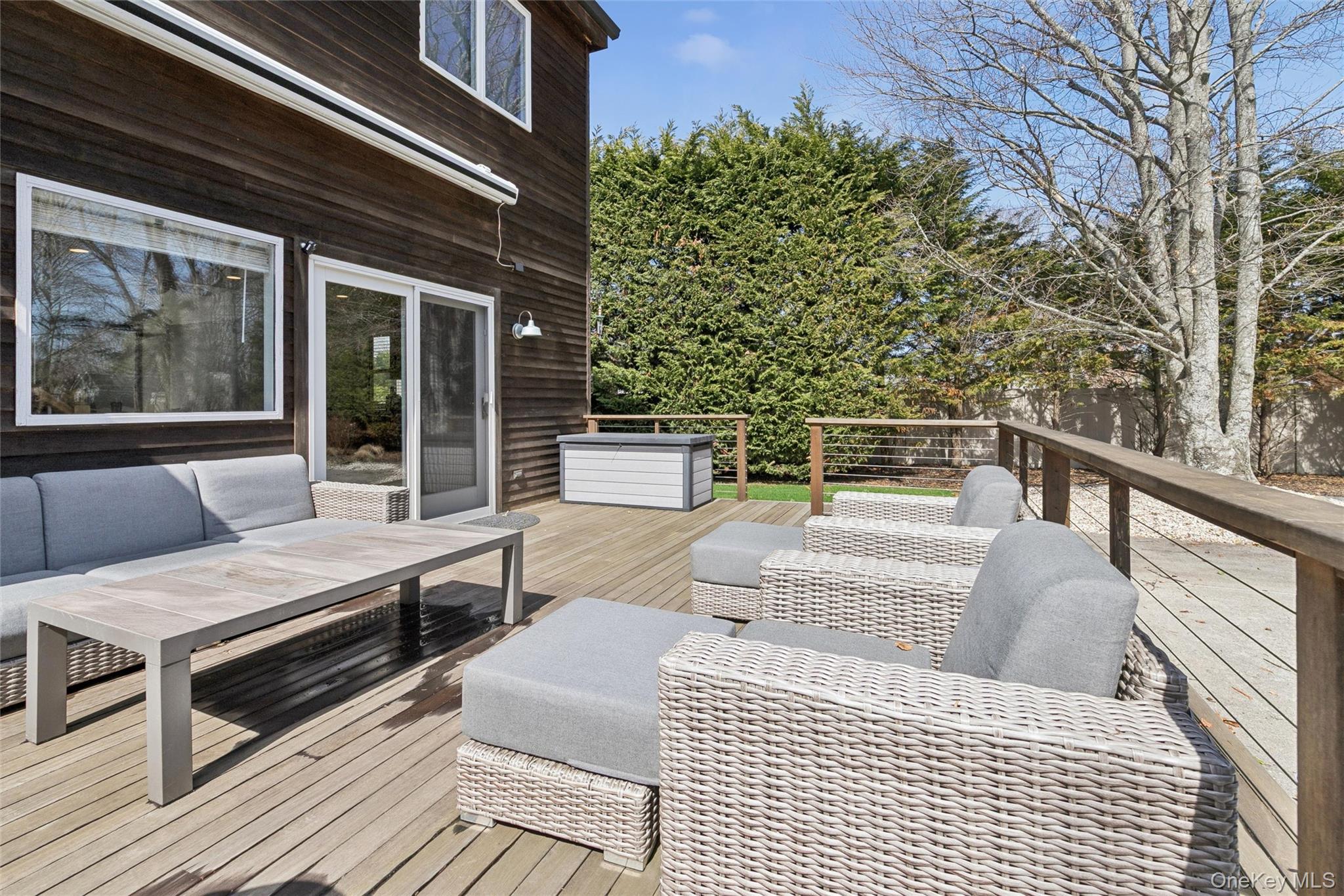 131 Lewis Road East Quogue, NY 11942 - Photo 24 of 25 a view of a roof deck with couches and wooden floor