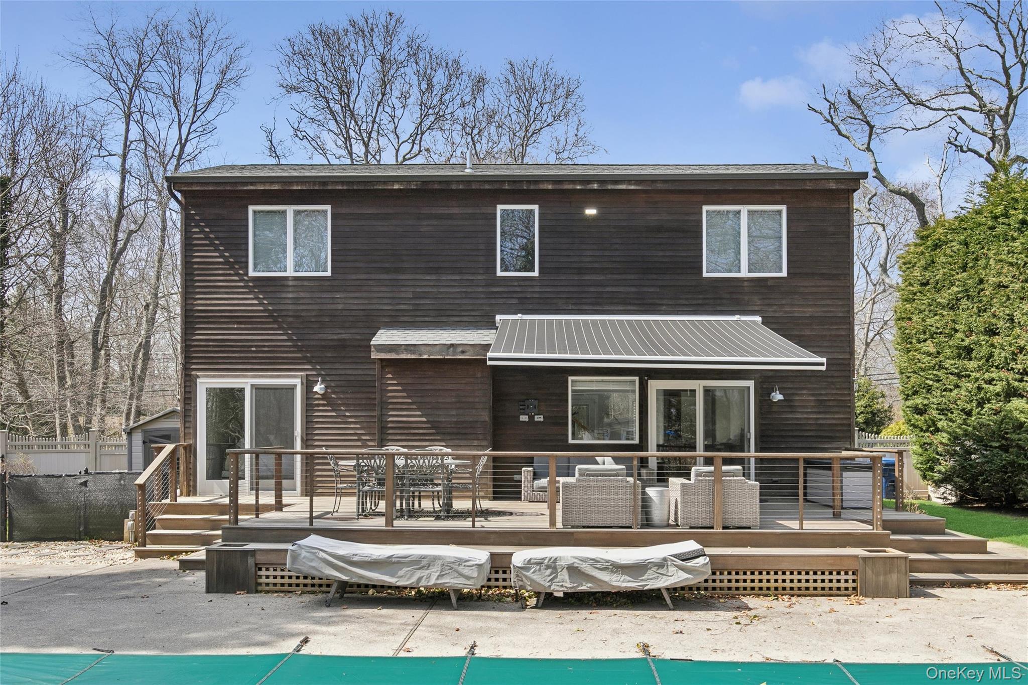131 Lewis Road East Quogue, NY 11942 - Photo 25 of 25 a front view of a house with a yard