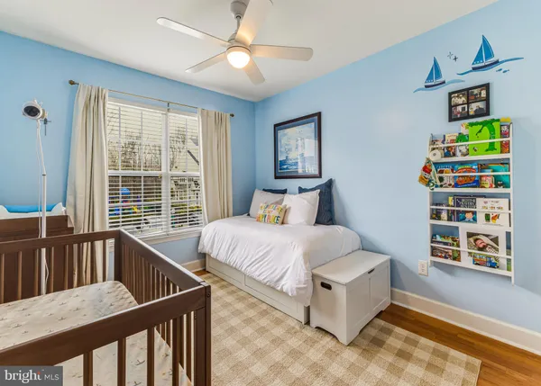 a bedroom with furniture and a window