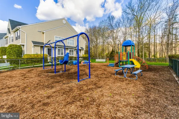 a view of a park with swings and slides