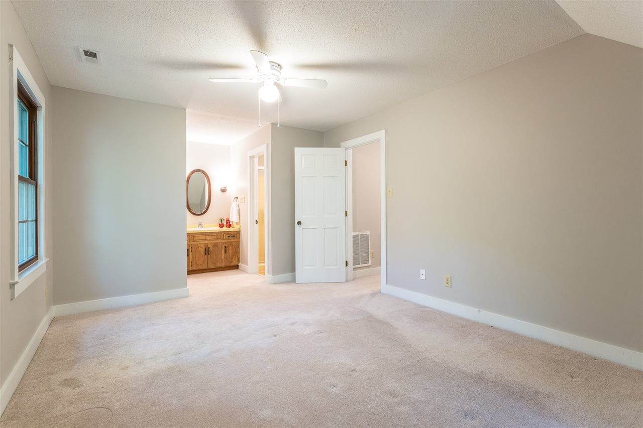 8816 Woodstone Drive Raleigh, NC 27615 - Photo 17 of 30 The true Master Bedroom is located on the second floor. Plenty of light with a side window and the dormer window. Large walk-in-closet. 2nd Floor Master Bedroom