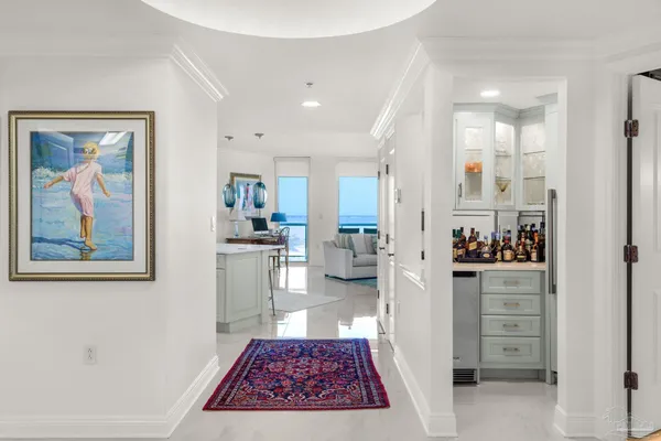 a kitchen with stainless steel appliances granite countertop a stove top oven a sink dishwasher and a refrigerator with the cabinets