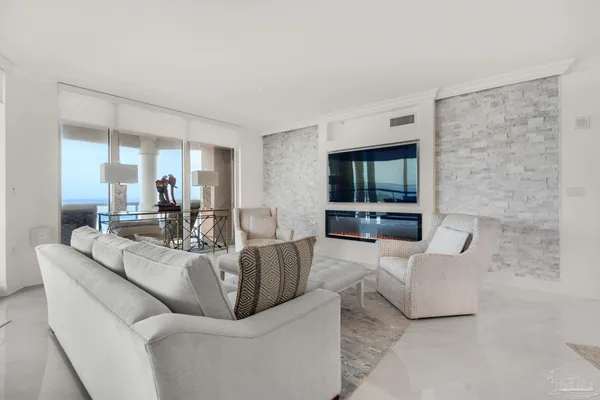 a living room with furniture and a large window