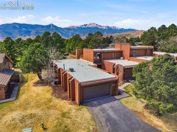 aerial view of a house with a yard