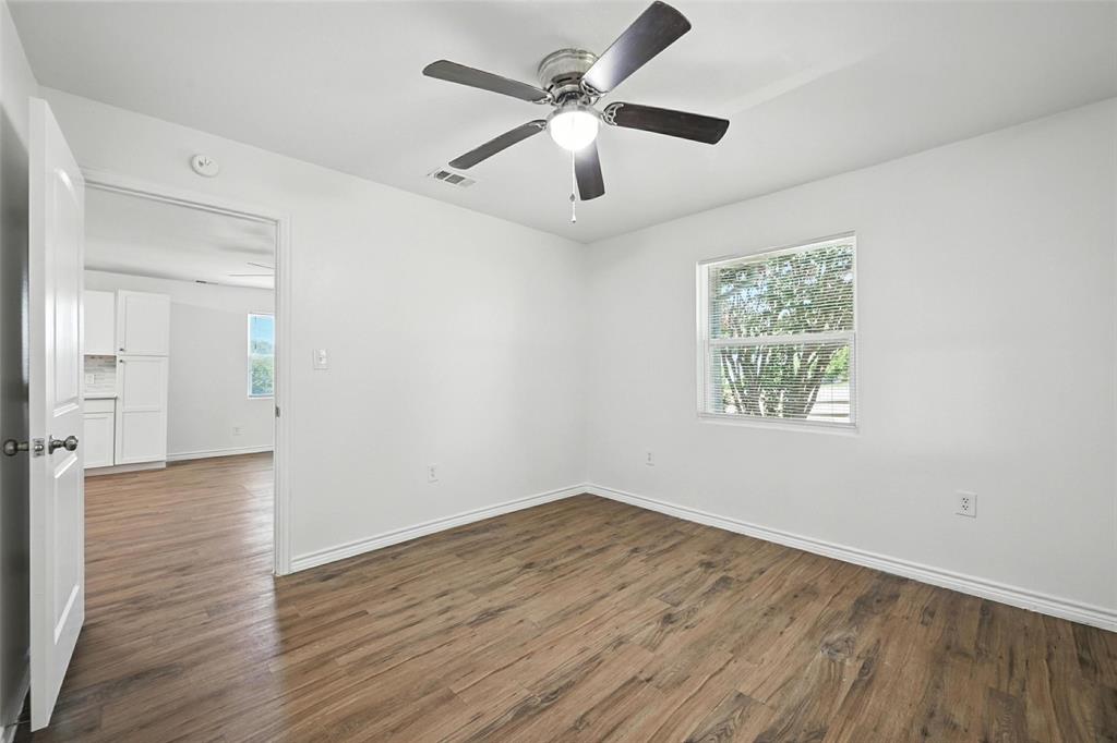 1206 North Business Highway Blue Ridge, TX 75424 - Photo 9 of 37 wooden floor in an empty room with a window