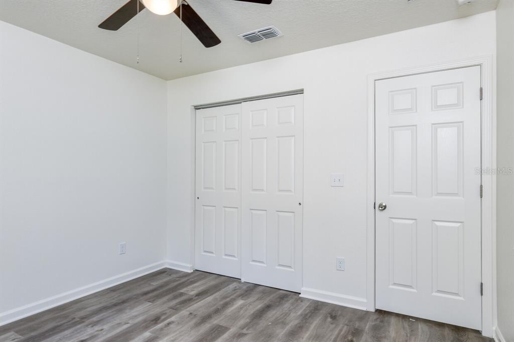 4840 Kenneth Street Hastings, FL 32145 - Photo 12 of 22 an empty room with a ceiling fan