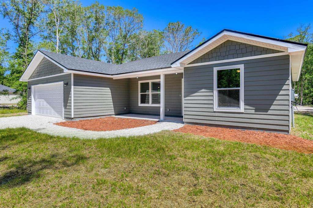 4840 Kenneth Street Hastings, FL 32145 - Photo 17 of 22 a front view of a house with yard