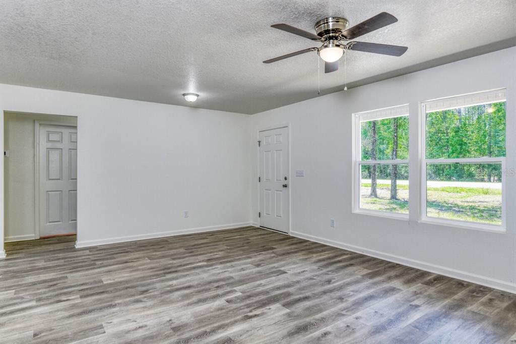 4840 Kenneth Street Hastings, FL 32145 - Photo 10 of 22 a view of empty room with wooden floor and fan